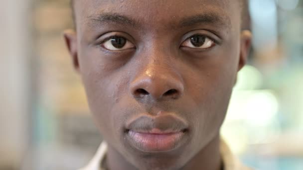 Close up of Serious Young African Man Looking at Camera — Stock Video