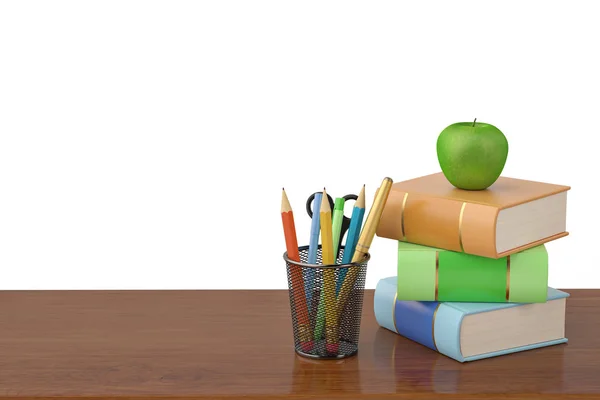Деякі книги та горщик для олівців на дерев'яному столі це зелене яблуко. — стокове фото
