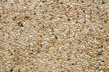 Multi renk küçük taşlarla arka plan duvar.