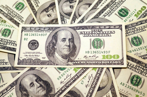 One hundred dollar banknotes background. 