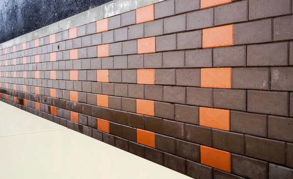 the wall of red building brick with accents