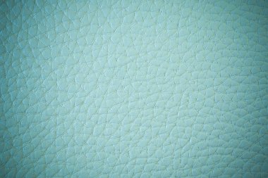 Suni deri dokusuna. Yeşilimsi mavi arka plan ışık yansıması ile.