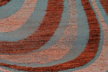 Doku sentetik örme kumaş Bodrum. Kahverengimsi gri arka plan.