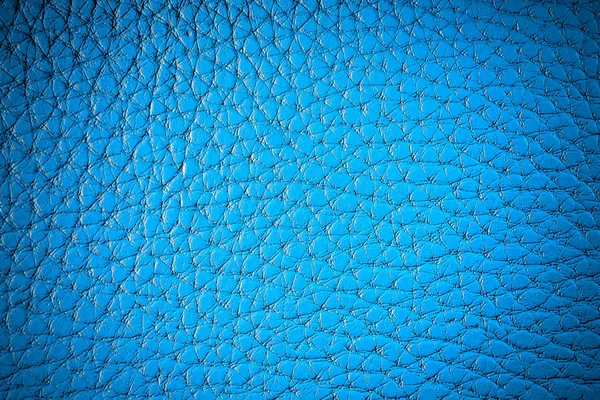 Texture of artificial leather. Dark blue background with vignette. — Stock Photo, Image