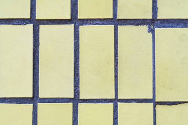 Sarı dikdörtgen Seramik döşeme arka planı. Seramik ile beton doku.