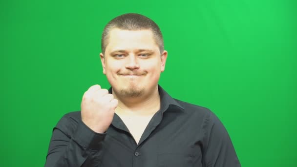Young man posing. Emotionally indignant. Background green screen. fuck — Stock Video