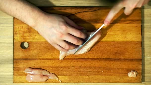 Closeup of hands slicing meat slices. — Stock Video