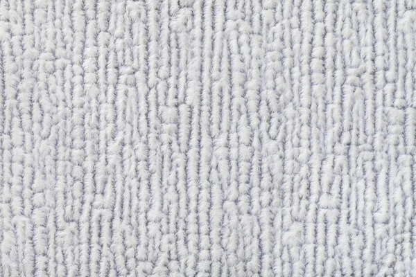 Light gray fluffy background of soft, fleecy cloth. Texture of textile closeup. — Stock Photo, Image