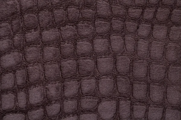 Fond brun à partir de matériaux textiles d'ameublement doux, gros plan. Tissu avec motif imitant la peau de crocodile .. — Photo