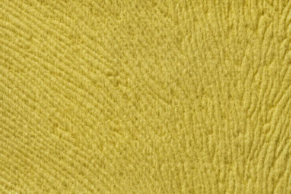 Žluté pozadí z měkkého textilního materiálu. Materiál s přirozenou texturou. — Stock fotografie