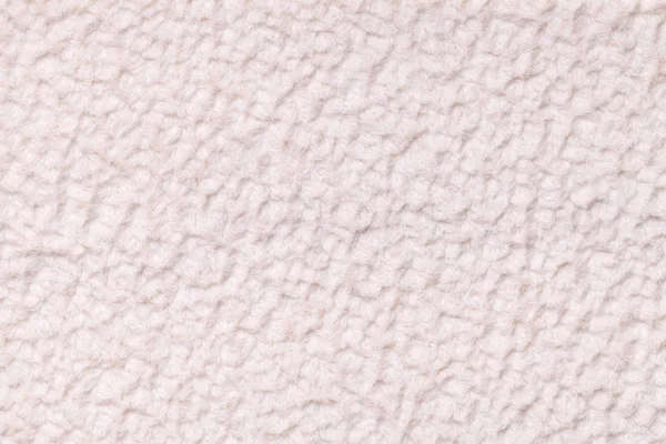 Светло-бежевый пушистый фон из мягкой, мимолетной ткани. Текстура текстильного крупного плана . — стоковое фото