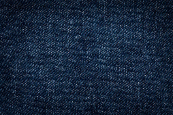 Dunkelblaue Jeans Hintergrund Nahaufnahme. strukturiertes Gewebe — Stockfoto