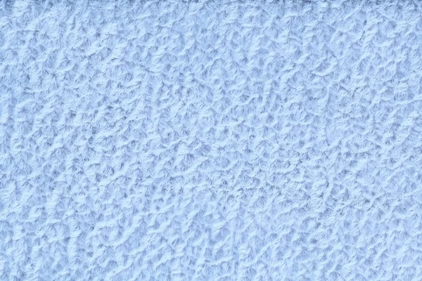 Ljusblå fluffig bakgrund av ulliga, mjuk trasa. Konsistens av textil närbild — Stockfoto