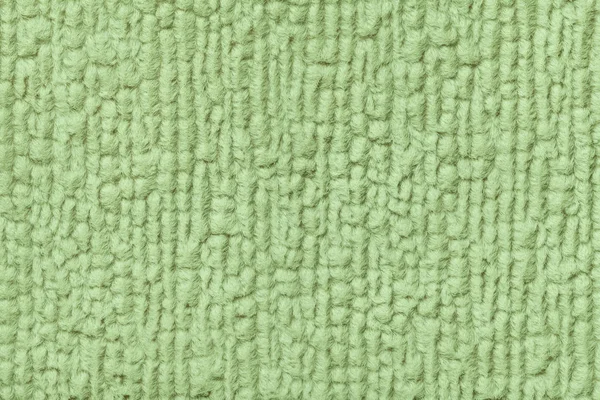 Groene achtergrond van zachte, wollige doek. Textuur van textiel closeup — Stockfoto