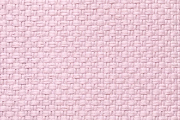 Světle růžové textilní pozadí s šachovnicovým vzorem, closeup. Struktura tkaniny makra. — Stock fotografie