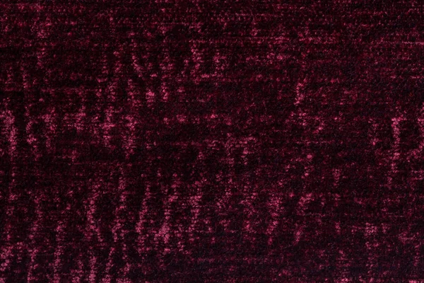 Fond duveteux rouge foncé en tissu doux et molletonné. Texture du gros plan textile — Photo