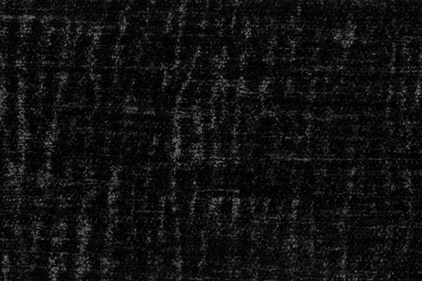 Schwarzer, flauschiger Hintergrund aus weichem, flauschigem Stoff. Textur von textilen Nahaufnahmen — Stockfoto