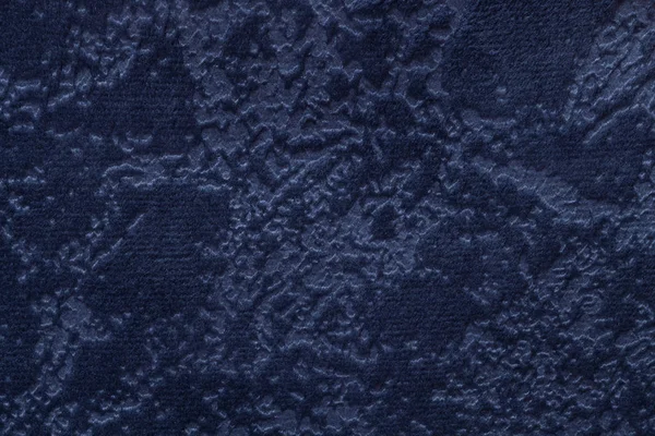 Navy blue background from a soft upholstery textile material, closeup.