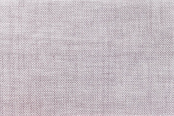 Light gray background of dense woven bagging fabric, closeup. Structure of the textile macro.