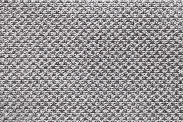 Light gray textile background with checkered pattern, closeup. Structure of the fabric macro.