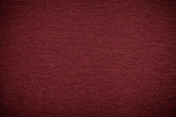 Eski koyu kırmızı kağıt arka plan, closeup doku. Yoğun kahverengi karton yapısını
