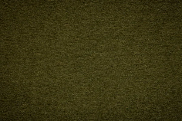 Textura del viejo primer plano del papel verde. La composición del cartón denso. El fondo negro . — Foto de Stock