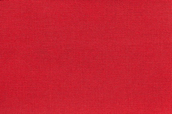 Fondo rojo oscuro de un material textil con patrón de mimbre, primer plano . — Foto de Stock