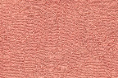 Bir tekstil malzemesinden açık kırmızı dalgalı renkli. Kumaş kat doku closeup ile.