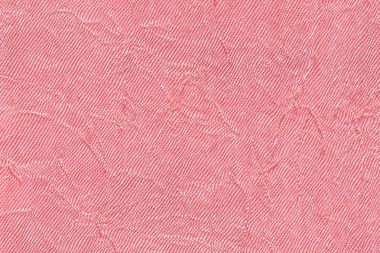 Açık pembe dalgalı renkli bir tekstil malzemesinden. Kumaş kat doku closeup ile.