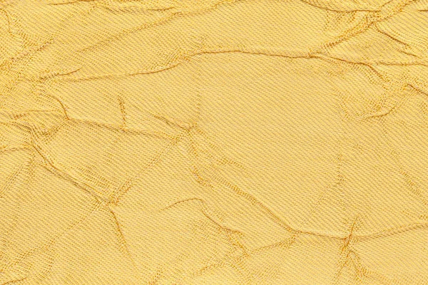 Bir tekstil malzemesinden açık sarı dalgalı renkli. Kumaş kat doku closeup ile. — Stok fotoğraf