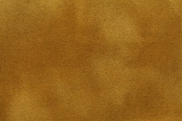 Fondo de tela de gamuza de oro oscuro primer plano. Textura de terciopelo mate de tejido nobuck amarillo —  Fotos de Stock