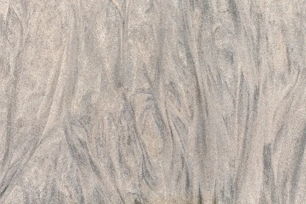 Siyahlısı sahilde kum — Stok fotoğraf