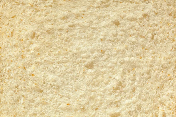 Background of a slice of freshly baked white bread close-up. — Stock Photo, Image