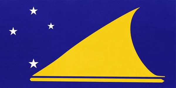 Bandeira de tecido nacional Tokelau, fundo têxtil. Símbolo do país oceânico mundial . — Fotografia de Stock