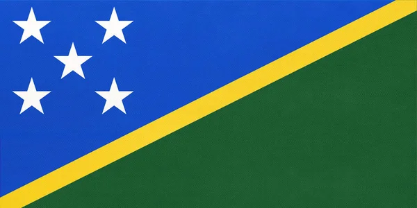 Solomon Islands national fabric flag, textile background. Symbol of world oceania country. — Stock Photo, Image