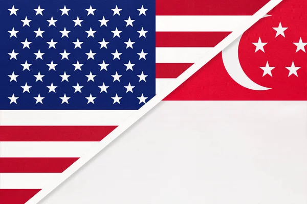 USA vs Singapore national flag from textile. Relationship between two american and asian countries. — Stock Photo, Image