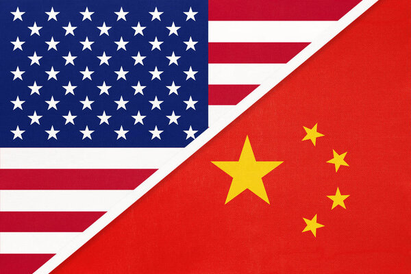 USA vs China national flag from textile. Relationship between two american and asian countries.