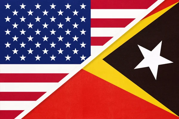 Уса проти Східного Тимору національний прапор з текстилю. Відносини між двома американськими та азійськими країнами. — стокове фото