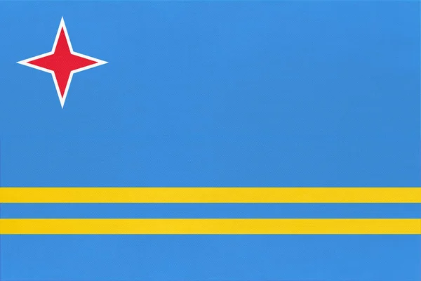 Текстильный фон флага Арубы. Официальный карибский знак . — стоковое фото