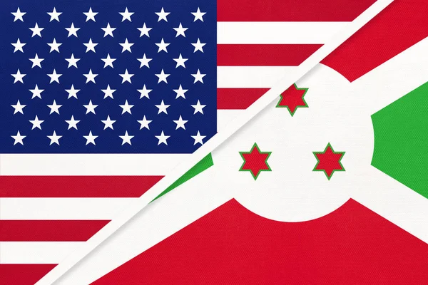 Національний прапор Уса проти Бурунді з текстилю. Відносини між двома американськими та африканськими країнами. — стокове фото