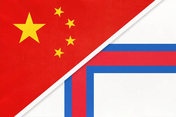 China or Prc vs Faroe Islands national flag from textile Відносини між азійськими та європійськими країнами. — стокове фото