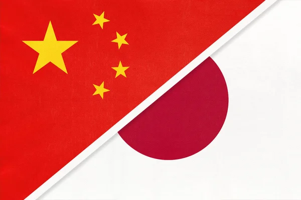 Китайська Народна Республіка або Prc vs Japan national flag from textile. Відносини між двома азійськими країнами. — стокове фото