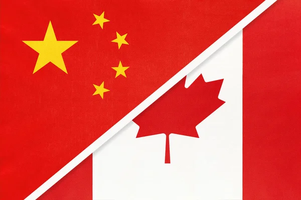 China or PRC vs Canada national flag from textile. Relationship between asian and american countries. — Stock Photo, Image