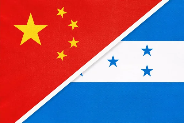China or PRC vs Honduras national flag from textile. Relationship between asian and american countries. — Stock Photo, Image