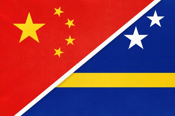 China or Prc vs Curacao national flag from textile Відносини між азійськими та американськими країнами. — стокове фото