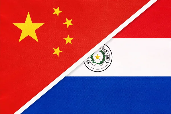 China or Prc vs Paraguay national flag from textile Відносини між азійськими та американськими країнами. — стокове фото