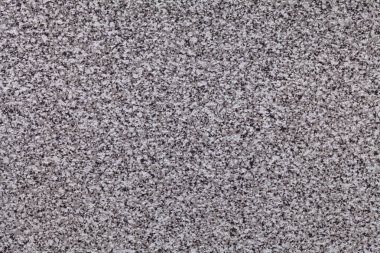 Beyaz ve gri benekli kumlu siyah bir arka plan. İç tasarım ve mutfak tezgahı için küçük kırıntı desenli doku arkaplanı.