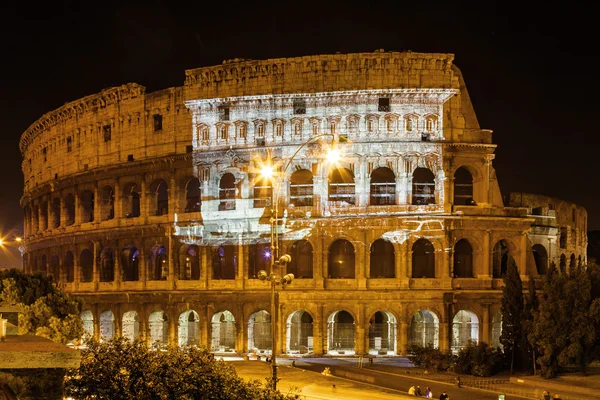 ITALY-ROME, 9 September 2010: Projector lights olympic pictures on Colosseo, Lazio region. Stock Photo