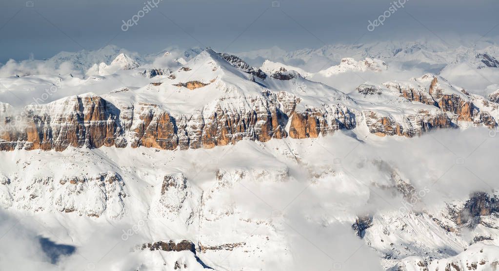 Sunny panoramic view of Dolomites from Marmolada glacier of Arabba, Trentino-Alto-Adige region, Italy.