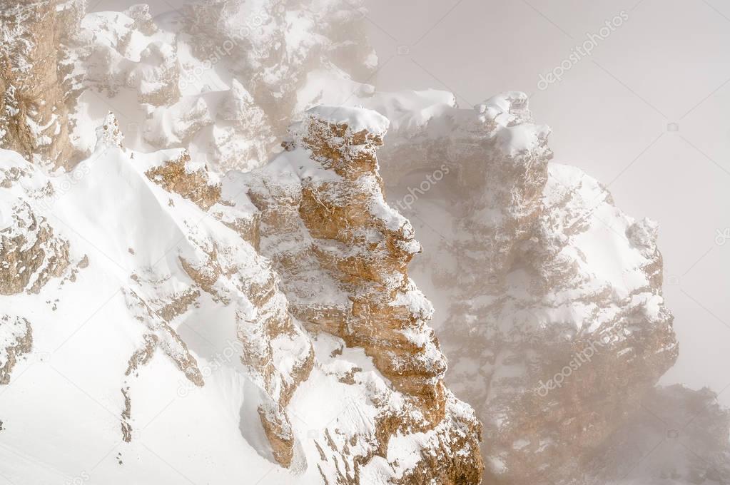 Foggy view of Dolomite Alps from viewpoint of Passo Pordoi near Canazei of Val di Fassa, Trentino-Alto-Adige region, Italy.